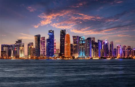 The Illuminated Urban Skyline Of Doha Qatar Stock Photo Download