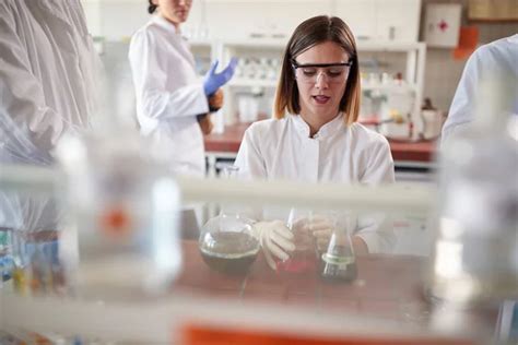 Young Female Students Pipetting Sterile Laboratory Environment Science