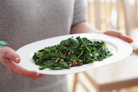 Blanched Spinach With Raisins And Pine Nuts Stock Photo Dissolve