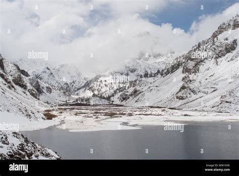 A Lake In The Sierra Nevada Mountains In Front Of Snow Covered Mountain