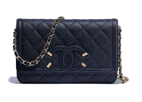 Beautiful chanel wallet on chain which is made from beige lambskin leather with exquisite camelia pattern all over. Check Out 65 of Chanel's Brand New Pre-Collection Spring ...