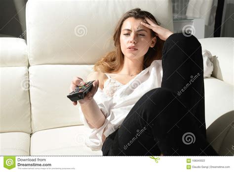 Beautiful Girl Is Bored Watching Tv Stock Photo Image Of Attractive
