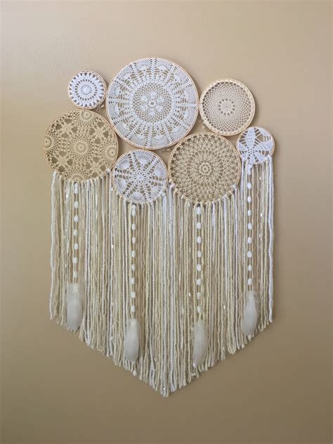 I really like this dream catcher wall hanging for its modern design and bohemian feel. Dream Catcher Wall Hanging Doily Dream Catcher Boho