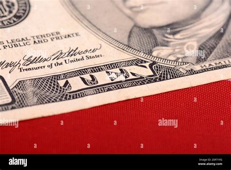 Ten Dollar Bill In Front Of The American Flag Stock Photo Alamy