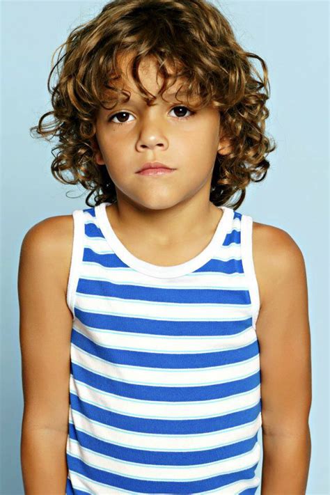 This natural curl look is wonderful for toddlers with natural hair. Shaina Leigh Photo | Boys with curly hair, Toddler haircuts, Boy haircuts long