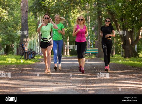 Women Running In Park Stock Photo Alamy