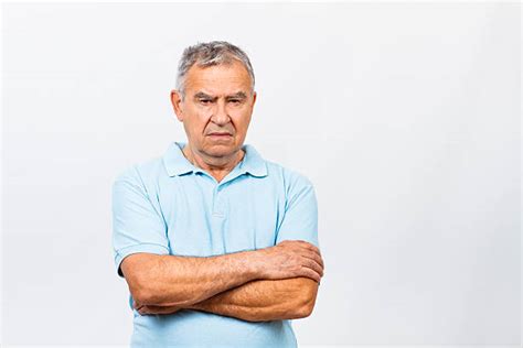 Royalty Free Angry Frowning Grumpy Middle Age Man With Arms Folded Pictures Images And Stock
