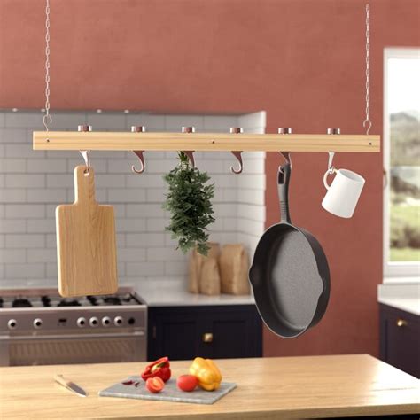 Hanging pot racks come in as a great way to store your pots and racks. Red Barrel Studio® Ceiling Mounted Wooden Hanging Pot Rack ...