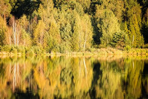 Beautiful Autumn Sunset At The Lake With Blue Sky Red And Orange