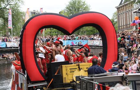 lgbt pride parade in amsterdam features boats as floats