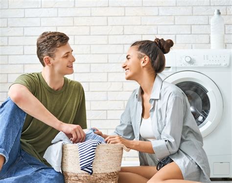 Premium Photo Loving Couple Is Doing Laundry