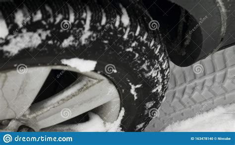 Close Up Of A Cars Tires On A Snowy Road Close Up Of Car Wheels Rubber
