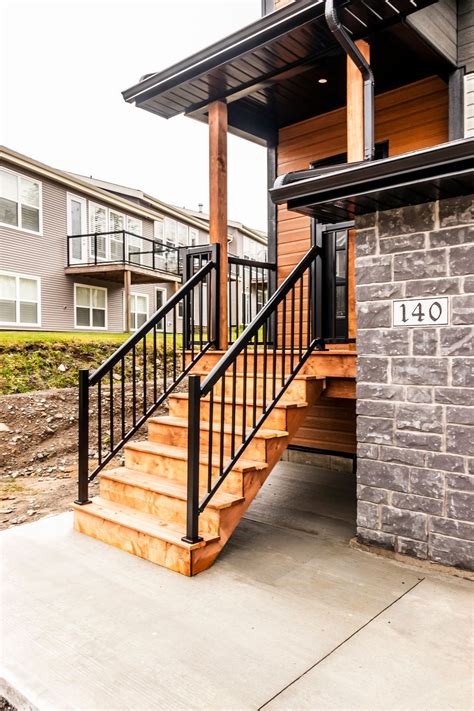 Welcome to our guide to stair railing ideas for interior designs. townhouse front entry with covered porch | Outdoor stair ...