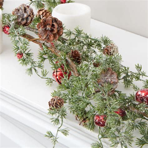 frosted artificial pine and jingle bell garland christmas garlands christmas and winter