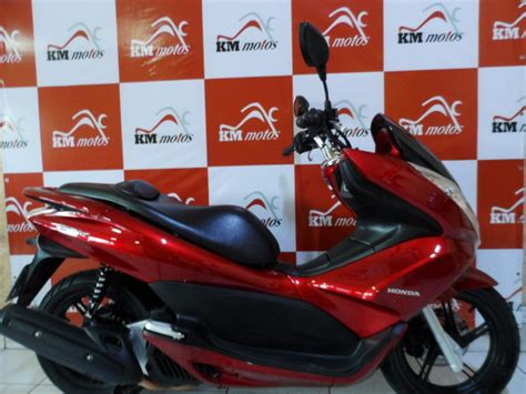 All information in this publication is based on the latest production information available at the time of approval for printing. Honda PCX 150 2014 Vermelha | KM Motos | Sua Loja de Motos ...