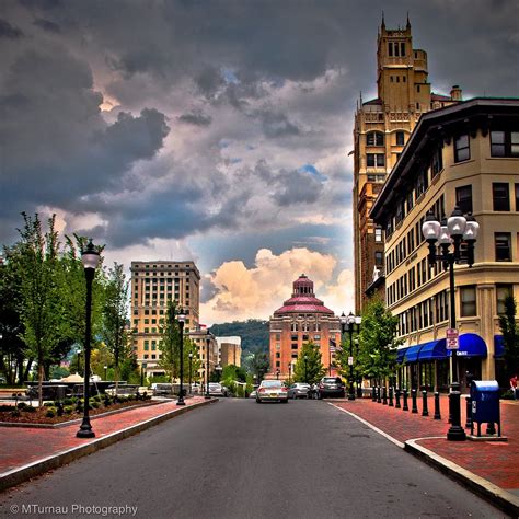 Coffee in the lobby and cleaning services for stayover guests are unavailable until further notice. Downtown Asheville - Pack Square | Asheville, NC looking ...
