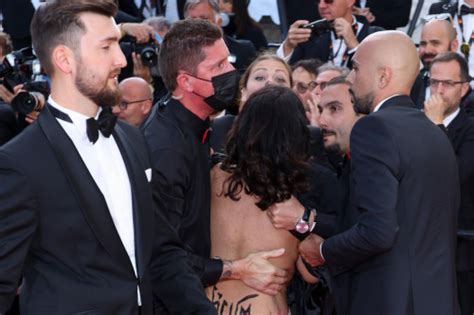 Nude Protester Storms Red Carpet At Cannes Film Festival