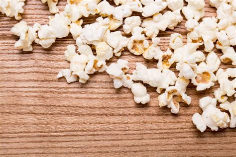 Heap Of Delicious Popcorn Isolated On Wooden Background Popcorn Close