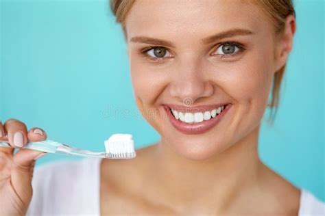 Woman With Beautiful Smile Healthy White Teeth With Toothbrush Stock