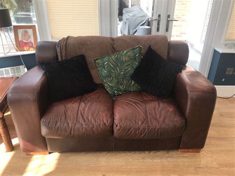 Dfs Three Seater And Two Seater And Ottamon Brown Leather Sofas For