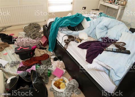 Showing Mess In A Teenage Girls Bedroom Including Foodclothes And Bags