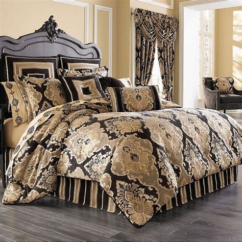 A Bed With Black And Gold Comforters In A Room