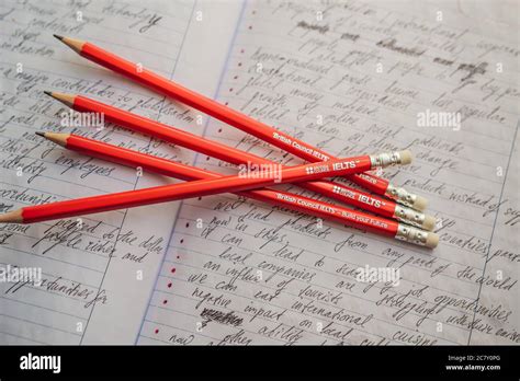 Ielts Red Pencils And Essay Notebook For The English Exam Stock Photo