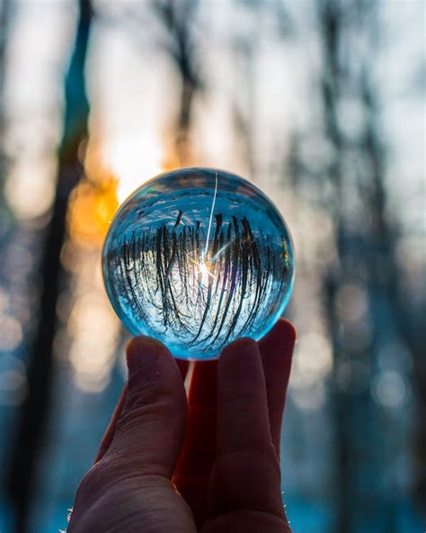 Photo Of Person Holding Crystal Ball · Free Stock Photo