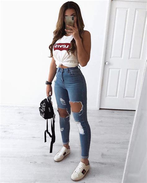 Black Girl Outfit With Ripped Jeans Crop Top And White Sneakers