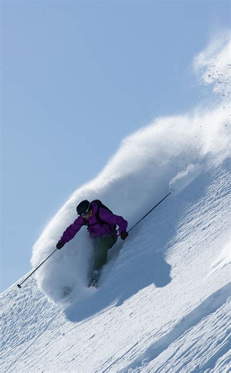 Skier Making Powder Turns Down A Steep Photograph By Adam Clark Fine Art America