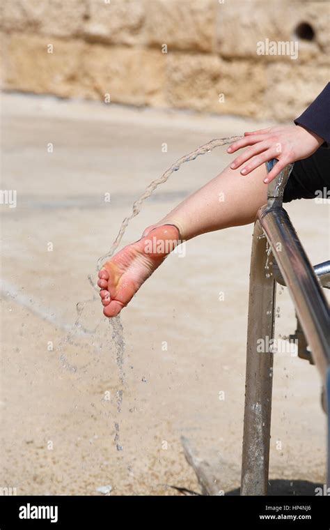 Close Up Of Teenager Foot Washing Sand From Beach Walk Tel Aviv