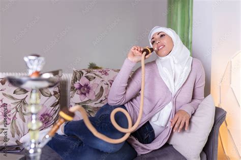 Muslim Woman Smoking Shisha At Home Muslim Young Woman Enjoying While
