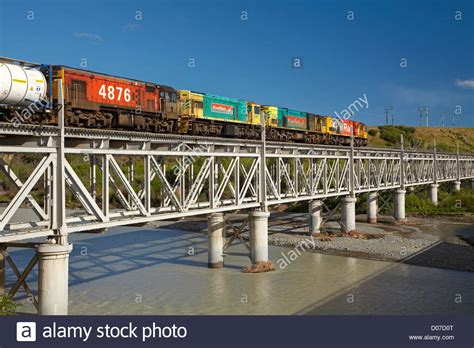 Freight Train On Historic Double Decker Road Rail Bridge