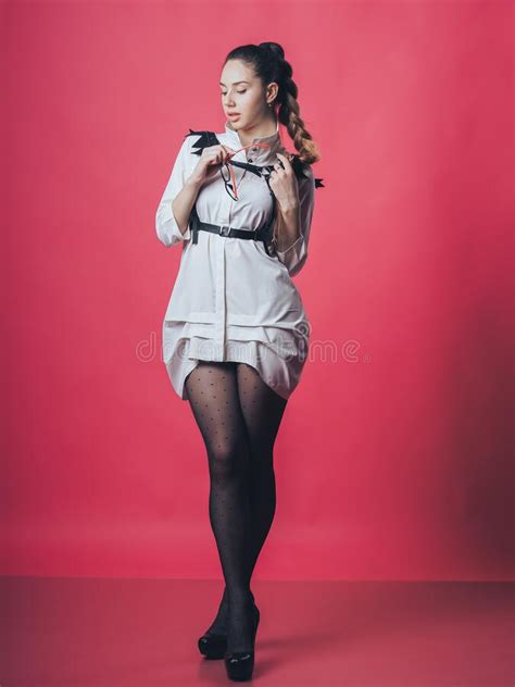 brunette girl posing at the pink background stock image image of model heels 175155559