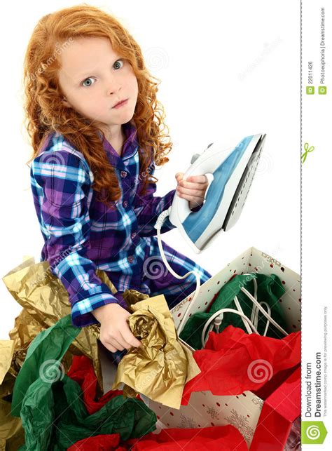 Angry Girl Child Opening An Iron For Christmas Royalty