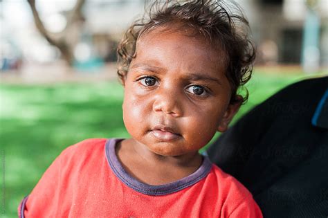 Wider Shot Of Little Aboriginal Girl Looking At Camera By Stocksy