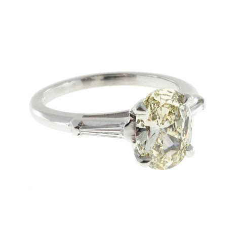 Posted 5 years ago in rings. Oval Light Yellow Diamond Platinum Baguette Engagement ...