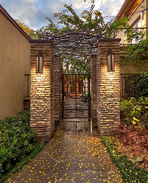 A metal trellis is usually beautiful with or without plants on it, making it a great all season garden addition. Contemporary gate with columns & custom iron trellis - Harold Leidner Landscape Architects ...