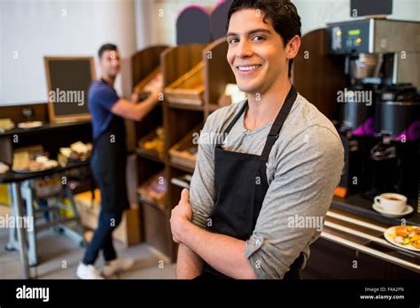 Handsome Waiters Smiling At Camera Stock Photo Alamy