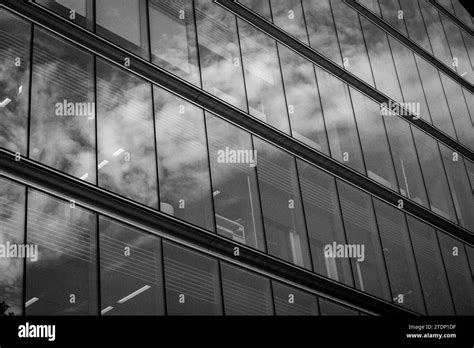 Modern Office Building Glass Facade Sky Reflection In Windows