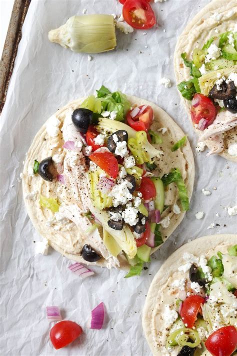 Line two baking sheets with parchment paper and pour wings onto them. Easy Mediterranean Chicken Wraps with Hummus | Recipe ...