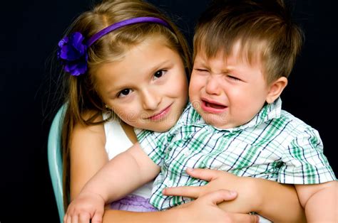 Girl Comforting Crying Baby Royalty Free Stock Image