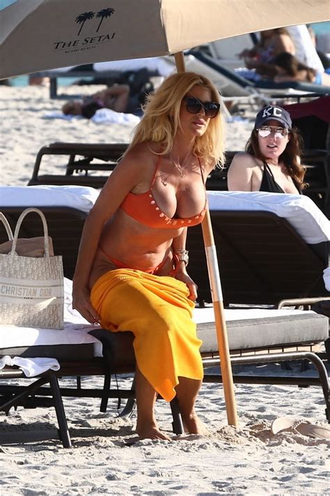 Victoria Silvstedt Slips Into An Orange Bikini While Soaking Up The Sun On The Beach In Miami