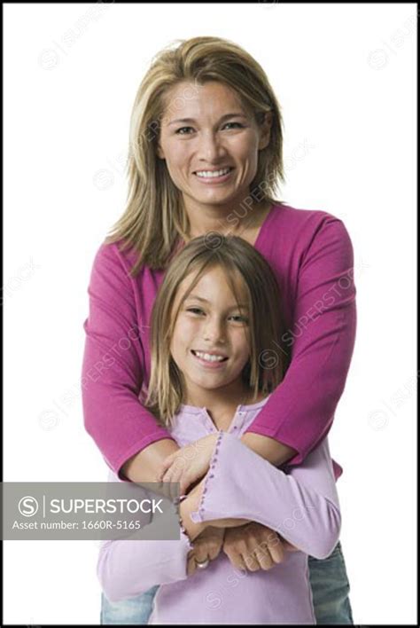 Portrait Of A Mother Hugging Her Daughter Superstock