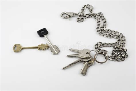 Bunch Of Door Keys With Chain Isolated On White Background Stock Photo