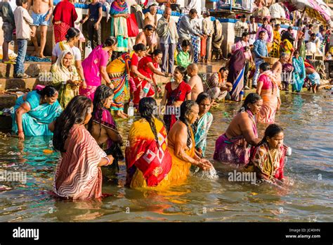 Pilgrims Are Taking Bath In The Holy River Ganges At Dashashwamedh Ghat