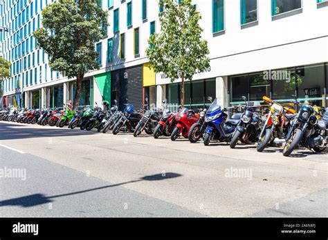 A Long Line Of Parked Motorcycles In An Urban Setting Stock Photo Alamy