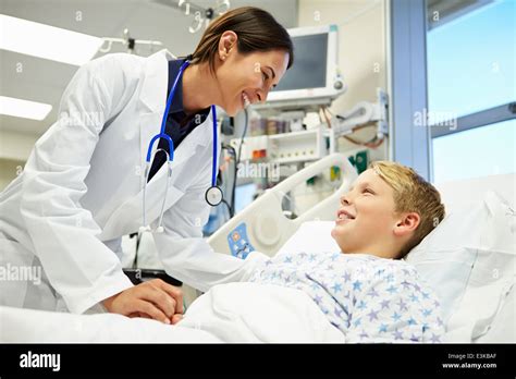 Boy Talking To Female Doctor In Emergency Room Stock Photo Alamy