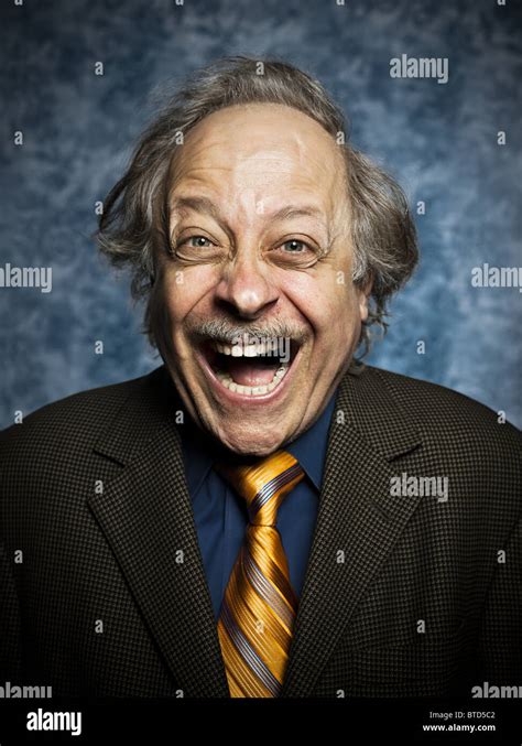 Studio Portrait Of Cheerful Senior Man Laughing Stock Photo Alamy