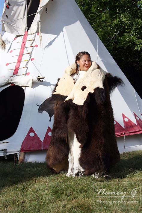 Native American Woman Standing In Front Of A Tipi Wearing A Buffalo Hide Nancy Greifenhagen